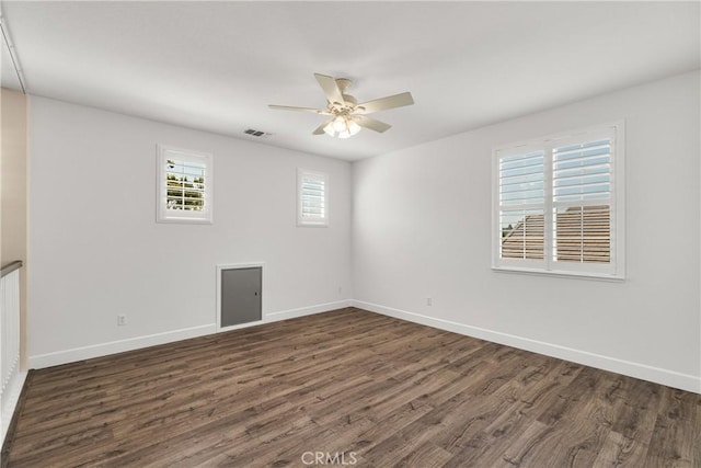 1689 Hometown Ln, Manteca, CA 95337 - spare room with dark wood-style flooring, baseboards, and ceiling fan