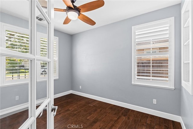 1689 Hometown Ln, Manteca, CA 95337 - unfurnished bedroom with dark wood-style flooring, baseboards, and a ceiling fan