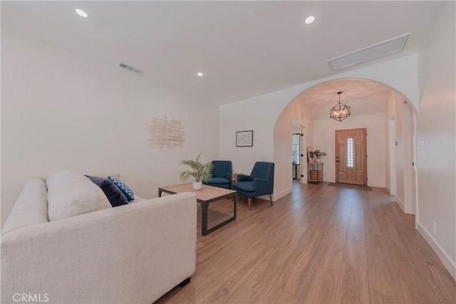 3448 Ferncroft Rd, Los Angeles, CA 90039 - living room featuring arched walkways, light wood-style flooring, baseboards, and recessed lighting