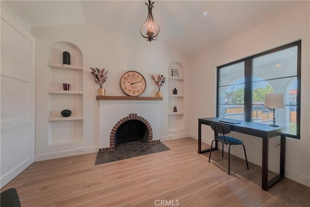 3448 Ferncroft Rd, Los Angeles, CA 90039 - office space with built in features, wood finished floors, vaulted ceiling, and baseboards