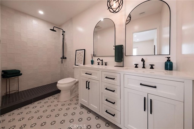 3448 Ferncroft Rd, Los Angeles, CA 90039 - full bathroom featuring a tile shower, double vanity, toilet, and recessed lighting