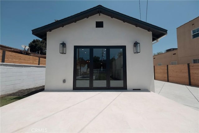 3448 Ferncroft Rd, Los Angeles, CA 90039 - rear view of house with stucco siding, a patio area, a fenced backyard, and french doors