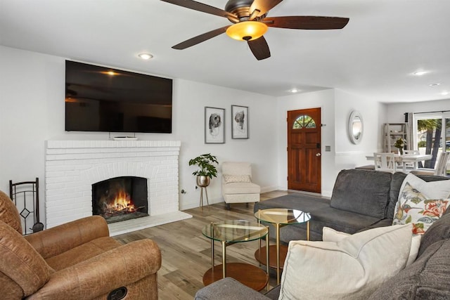 15576 Paseo Ajanta, San Diego, CA 92129 - living area featuring recessed lighting, a ceiling fan, wood finished floors, a fireplace, and baseboards