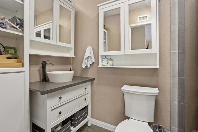15576 Paseo Ajanta, San Diego, CA 92129 - full bathroom with toilet, vanity, and baseboards