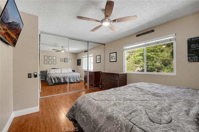 19836 White Spring Ln, Yorba Linda, CA 92886 - bedroom featuring a textured ceiling, wood finished floors, baseboards, a ceiling fan, and a closet