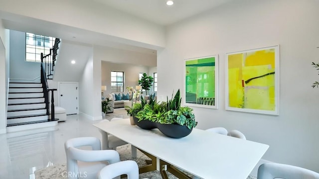 dining area featuring stairway and recessed lighting