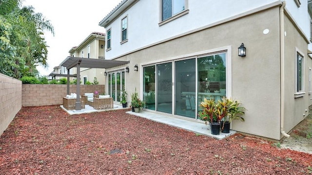fenced backyard with a patio area