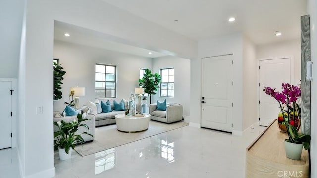 living area with recessed lighting and baseboards