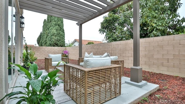 view of patio / terrace with a pergola and a fenced backyard