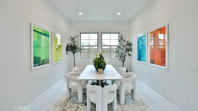 dining area featuring baseboards and recessed lighting