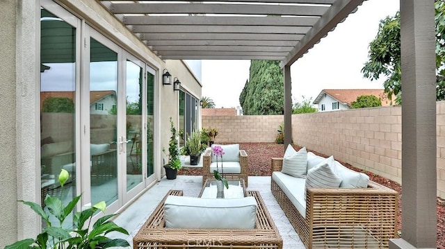 view of patio / terrace featuring a pergola, a fenced backyard, french doors, and an outdoor hangout area