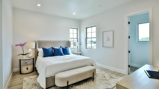 bedroom featuring light wood-style flooring, baseboards, and recessed lighting