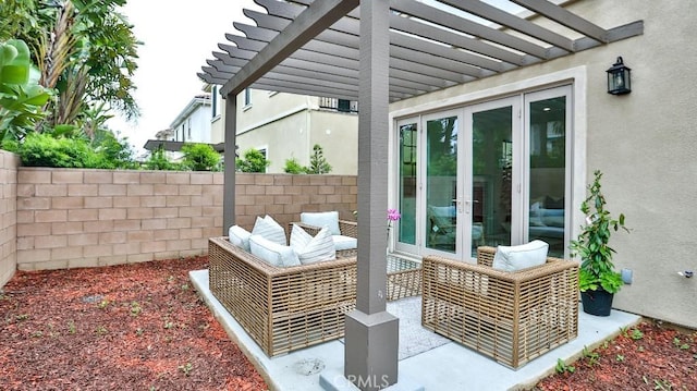 view of patio with french doors, a pergola, and fence