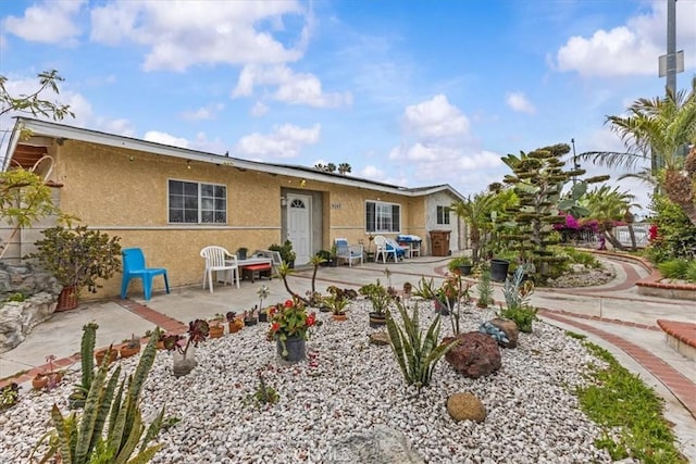 9502 Westminster Ave, Garden Grove, CA 92844 - back of property with a patio area and stucco siding