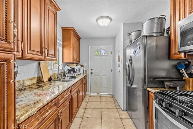 9502 Westminster Ave, Garden Grove, CA 92844 - kitchen featuring a sink, stainless steel microwave, healthy amount of natural light, and brown cabinets