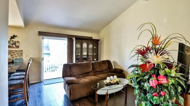 86069 Village Unit 69, Costa Mesa, CA 92626 - living area featuring vaulted ceiling and hardwood / wood-style flooring