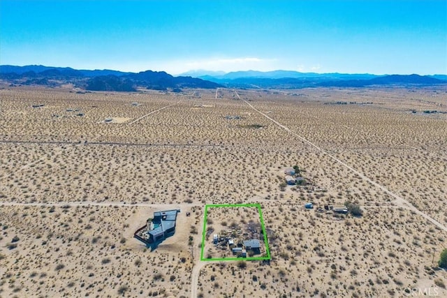 7037 Calapooya Way, Joshua Tree, CA 92252 - view of rural area with a mountain backdrop, a desert landscape, and property parcel outlined