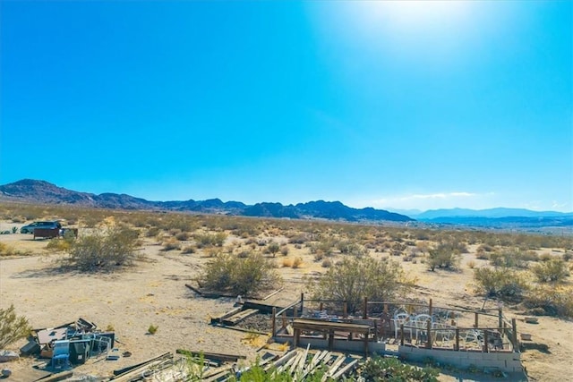 7037 Calapooya Way, Joshua Tree, CA 92252 - view of mountain backdrop featuring a desert landscape and rural landscape