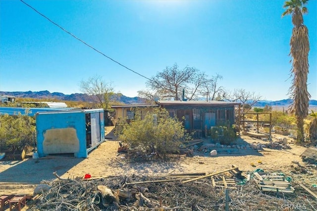 7037 Calapooya Way, Joshua Tree, CA 92252 - view of front facade featuring a mountain view