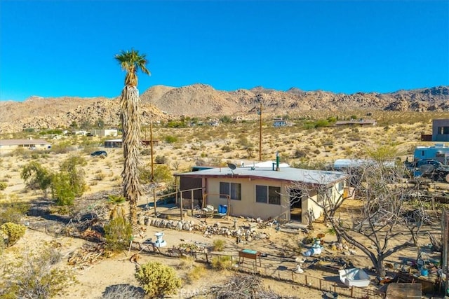 7037 Calapooya Way, Joshua Tree, CA 92252 - rear view of property featuring a mountain view, view of desert, and stucco siding