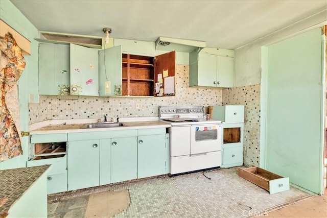 7037 Calapooya Way, Joshua Tree, CA 92252 - kitchen featuring electric range, a sink, open shelves, and decorative backsplash