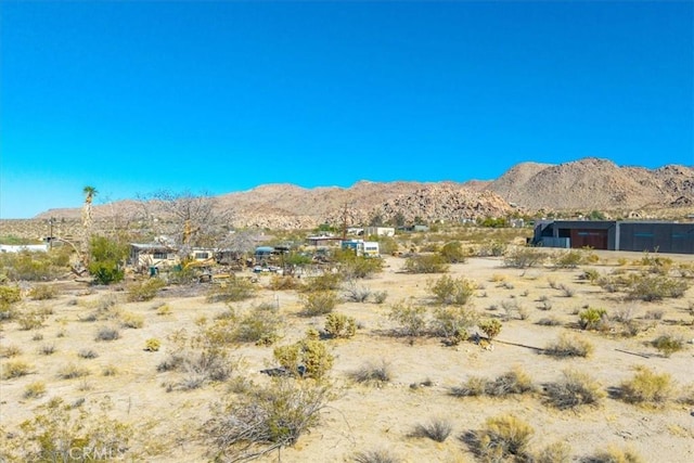 7037 Calapooya Way, Joshua Tree, CA 92252 - view of mountain backdrop with a desert landscape and rural landscape