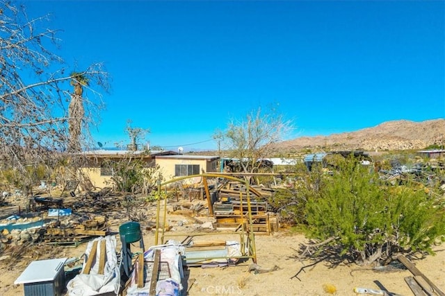 7037 Calapooya Way, Joshua Tree, CA 92252 - back of house featuring a mountain view