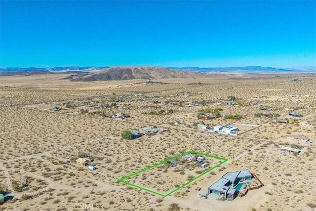 7037 Calapooya Way, Joshua Tree, CA 92252 - aerial view of sparsely populated area featuring a desert landscape, property parcel outlined, and mountains