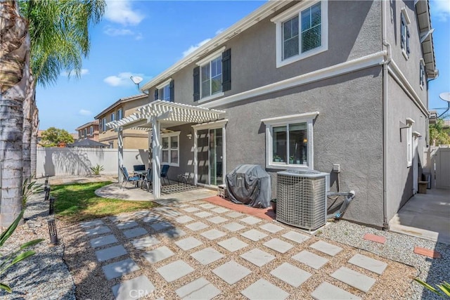 893 Whimbrel Way, Perris, CA 92571 - back of property with a pergola, central AC, a fenced backyard, stucco siding, and a patio