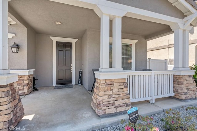 893 Whimbrel Way, Perris, CA 92571 - view of exterior entry with covered porch and stucco siding