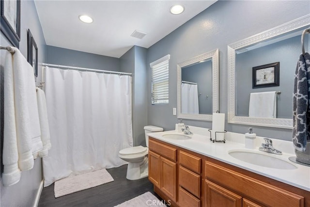 893 Whimbrel Way, Perris, CA 92571 - full bathroom with wood finished floors, double vanity, toilet, and recessed lighting