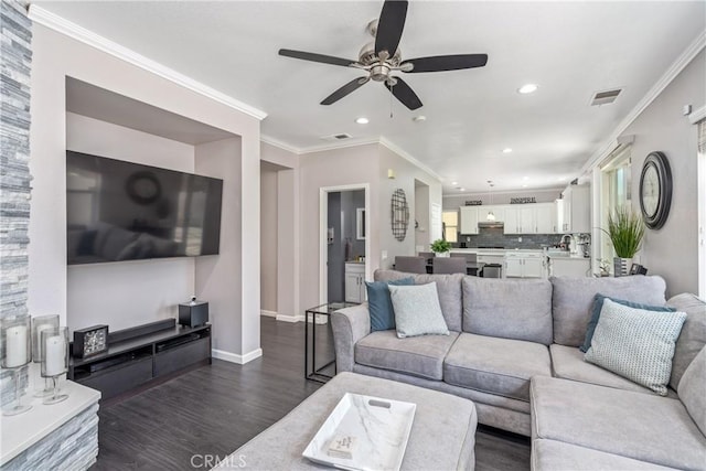 893 Whimbrel Way, Perris, CA 92571 - living area with dark wood-style floors, ceiling fan, recessed lighting, crown molding, and baseboards