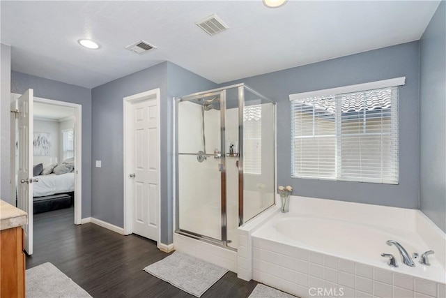 893 Whimbrel Way, Perris, CA 92571 - bathroom featuring ensuite bath, a garden tub, a shower stall, wood finished floors, and recessed lighting