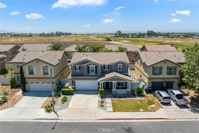 893 Whimbrel Way, Perris, CA 92571 - view of front of home with a garage, a residential view, and driveway