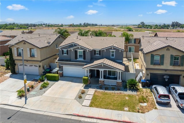 893 Whimbrel Way, Perris, CA 92571 - view of front of property featuring an attached garage, covered porch, concrete driveway, and a residential view