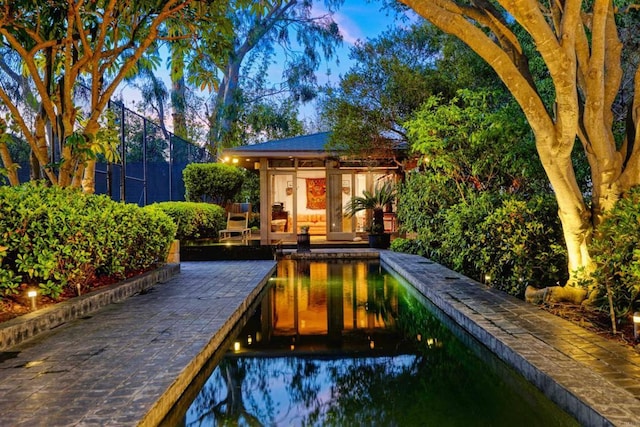 567 Gage Ln, San Diego, CA 92106 - pool at dusk featuring an outbuilding