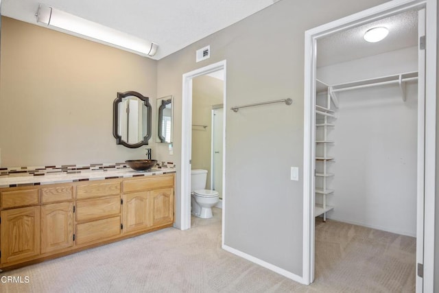 433 Havenside Ave, Newbury Park, CA 91320 - bathroom with toilet, a spacious closet, and vanity