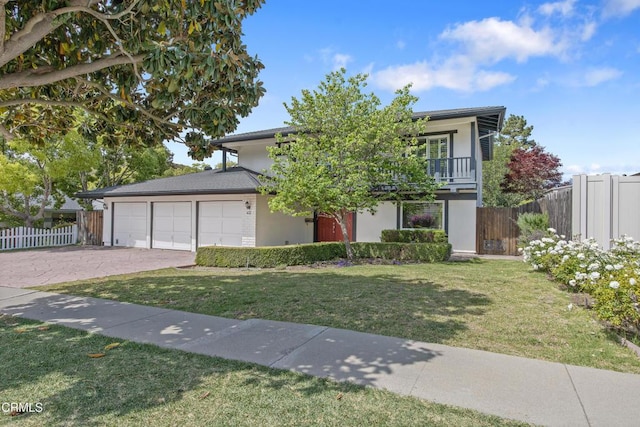 433 Havenside Ave, Newbury Park, CA 91320 - view of front of home with an attached garage, driveway, a balcony, and stucco siding