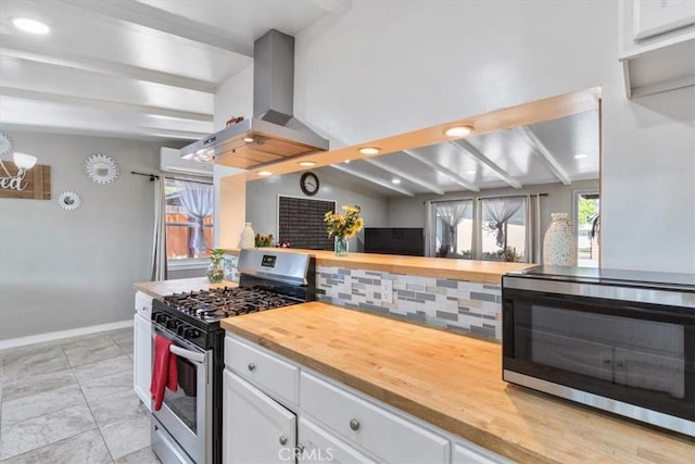 38868 Yucca Tree St, Palmdale, CA 93551 - kitchen with appliances with stainless steel finishes, butcher block countertops, ventilation hood, baseboards, and beamed ceiling