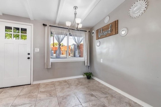38868 Yucca Tree St, Palmdale, CA 93551 - unfurnished dining area featuring a chandelier, beamed ceiling, and baseboards