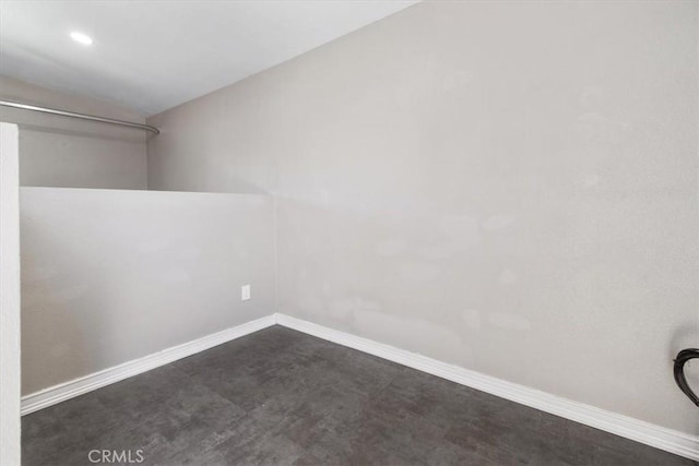 38868 Yucca Tree St, Palmdale, CA 93551 - empty room with lofted ceiling, baseboards, dark carpet, and recessed lighting