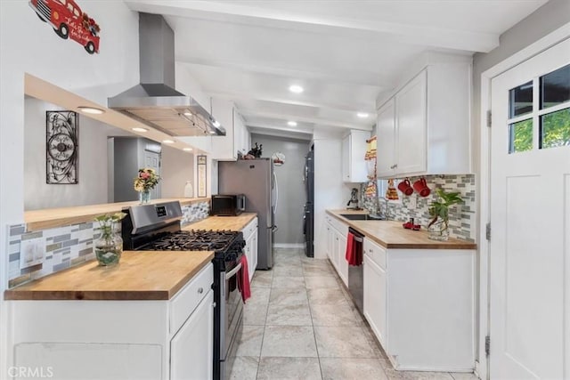 38868 Yucca Tree St, Palmdale, CA 93551 - kitchen with stainless steel appliances, butcher block counters, wall chimney range hood, backsplash, and recessed lighting