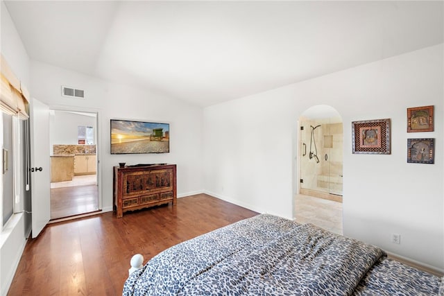 28751 Top Of The World Dr, Laguna Beach, CA 92651 - bedroom featuring arched walkways, wood finished floors, connected bathroom, and baseboards