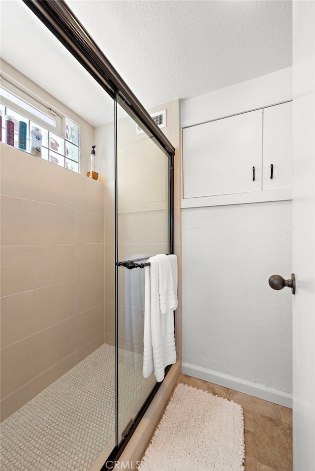 28751 Top Of The World Dr, Laguna Beach, CA 92651 - bathroom with walk in shower, tile patterned flooring, and baseboards