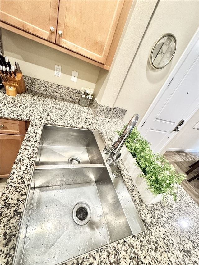 299 E Arrow Hwy Unit 4, Glendora, CA 91740 - kitchen view of light stone counters and a sink