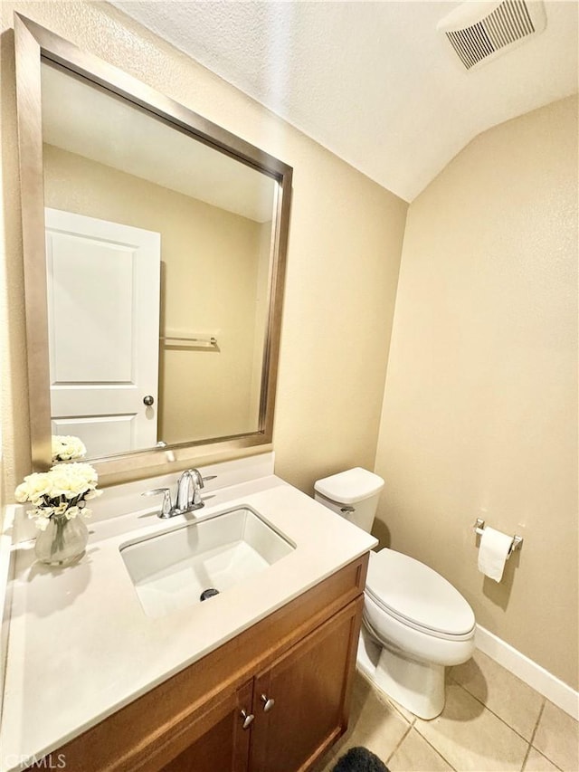 299 E Arrow Hwy Unit 4, Glendora, CA 91740 - half bathroom featuring vanity, toilet, tile patterned flooring, and baseboards
