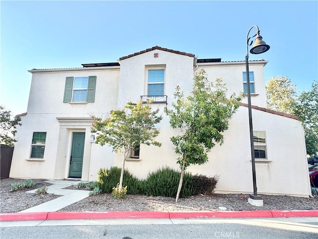 299 E Arrow Hwy Unit 4, Glendora, CA 91740 - view of front facade with stucco siding and a tiled roof