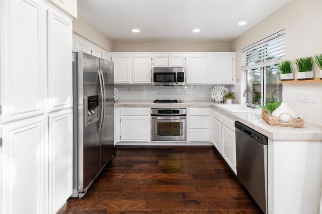 3362 Edgeview, San Marcos, CA 92078 - kitchen with stainless steel appliances, a sink, light countertops, white cabinetry, and backsplash