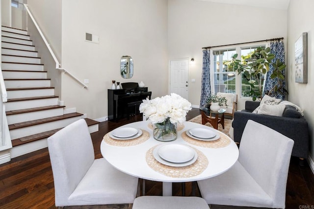3362 Edgeview, San Marcos, CA 92078 - dining room featuring high vaulted ceiling, stairway, dark wood-style floors, and baseboards