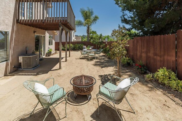 3362 Edgeview, San Marcos, CA 92078 - fenced backyard featuring a fire pit, central AC unit, outdoor dining space, and a patio area